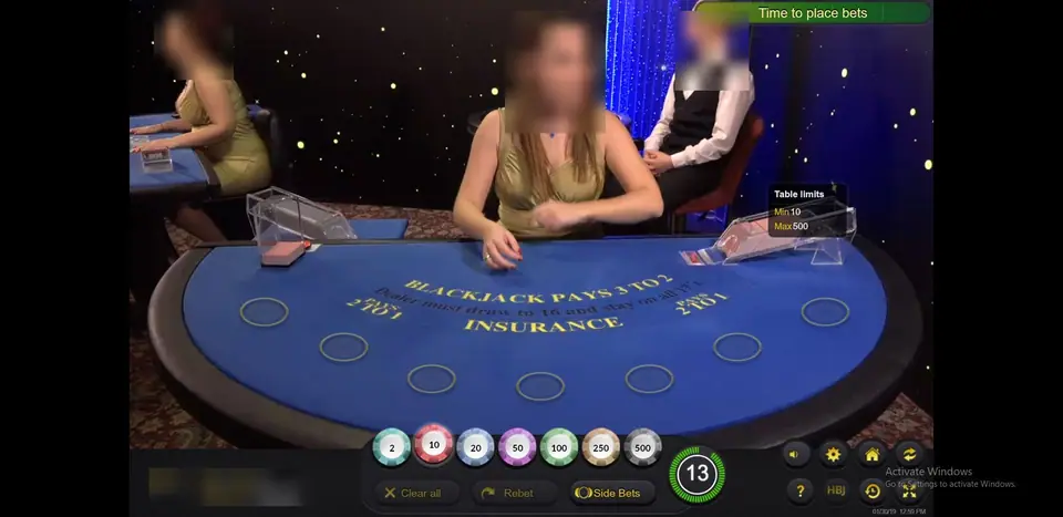 Ezugi seven-seat blackjack table with Blackjack pays 3 to 2 and Insurance pays 2 to 1 on blue felt, table limits 10 to 500 and chips from 2 to 500
